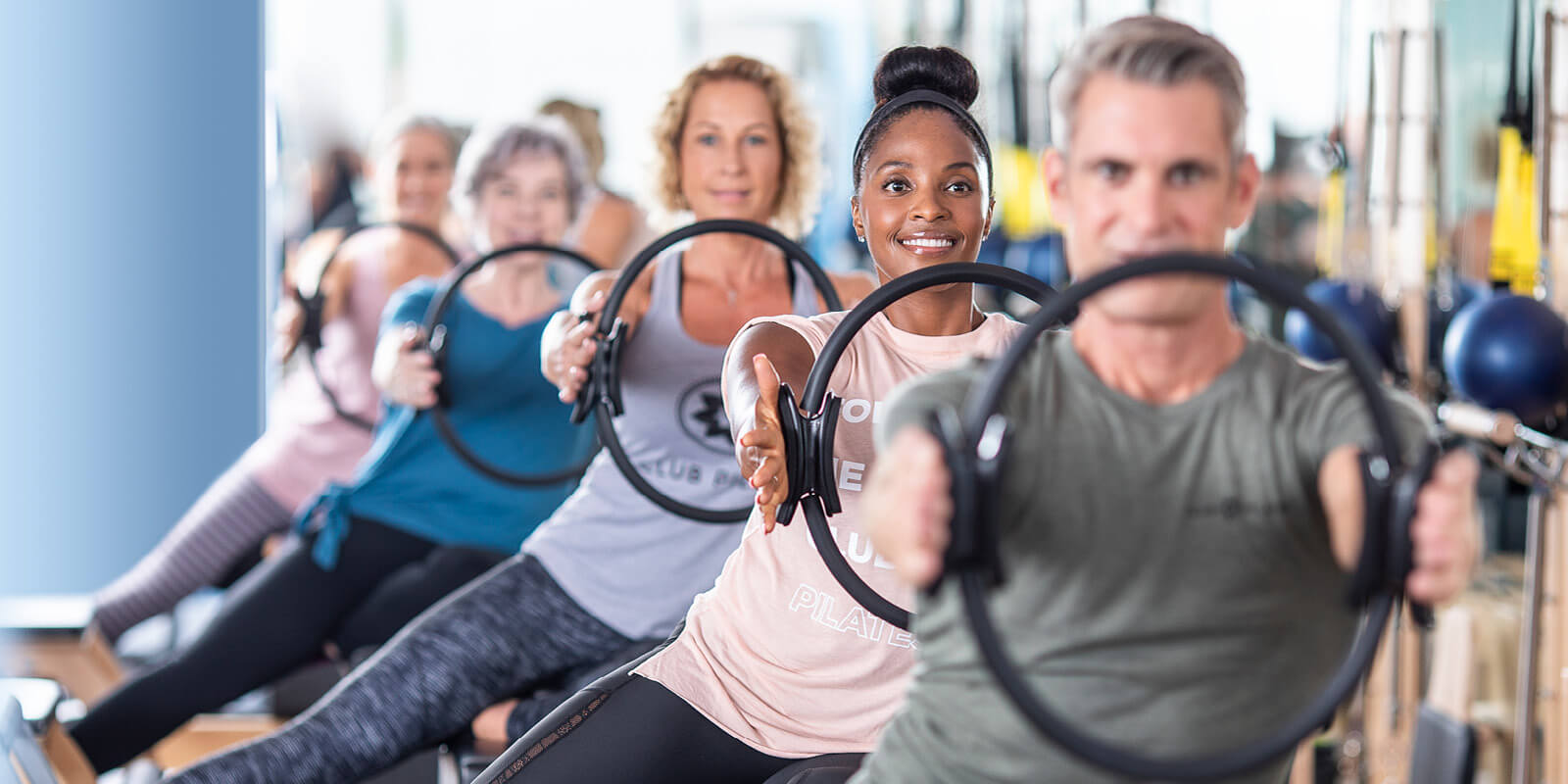 Men and woman doing pilates